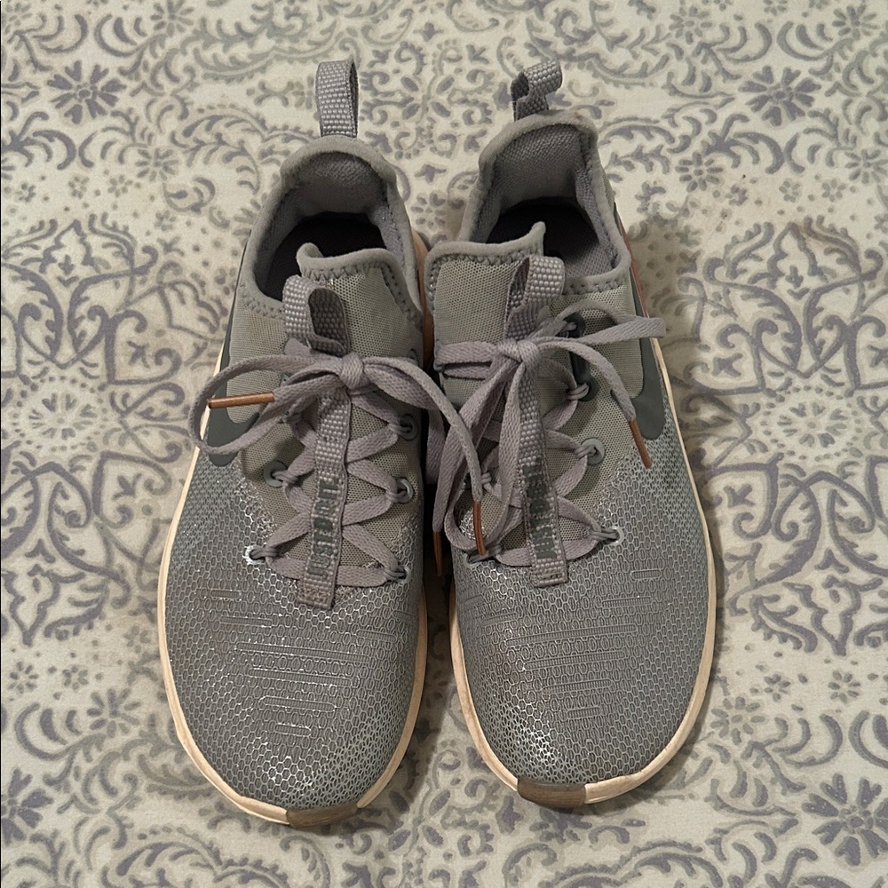 Shiny muted blue and rose gold Nikes